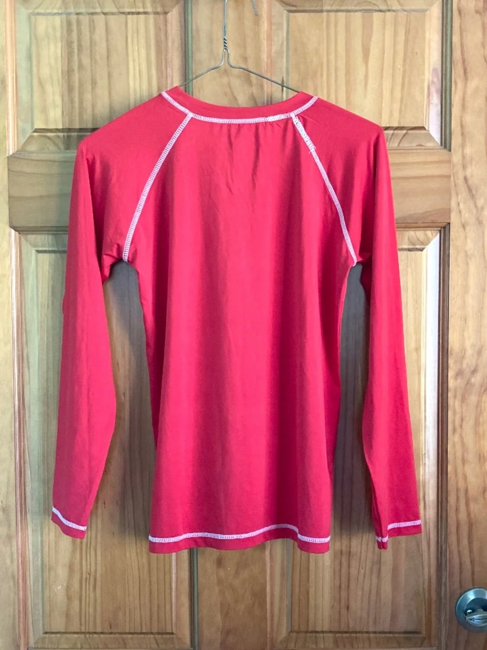 Boy’s size 12/14 Quad Seven long sleeved red swim shirt/rash guard